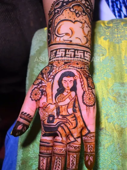 A devotional design created for a client, this mehndi portrays a woman worshipping a Shivling under a tree. The wristband features a Nandi bull and Swastika symbols, adding layers of meaning.