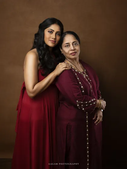 A beautiful and elegant fine art portrait capturing the bond between a mother and her own mother. This two-generation shot is a testament to the legacy of love passed down through family.