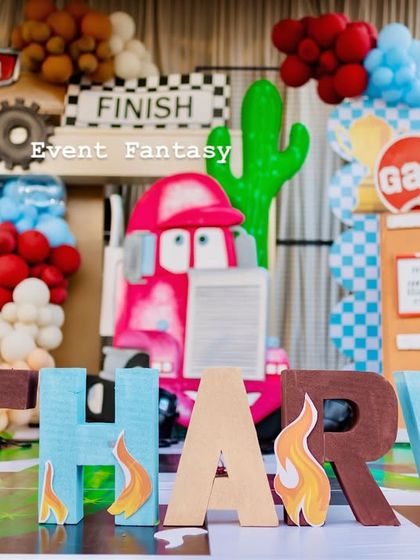 The custom "ATHARVA" name display with flame details, perfectly matching the Disney Cars theme.