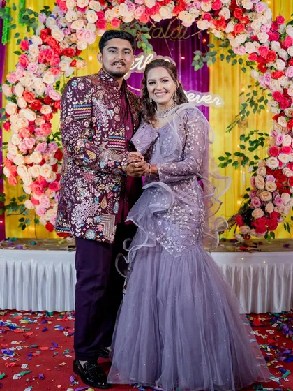 Stand out in a crowd with this bold and festive look. My client is wearing a heavily embroidered maroon Indo-Western sherwani, an excellent choice for a vibrant sangeet or wedding celebration. It’s all about celebrating in style.