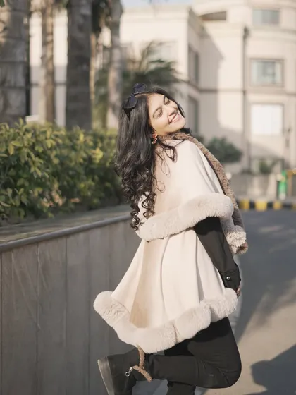 A playful and happy shot in my winter cape. Your clothes should make you feel this good.