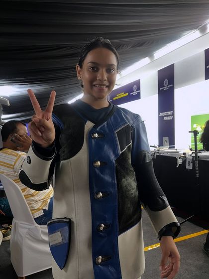 A happy shooter flashes a victory sign at the CBSE South Zone Shooting Championship in Kollam, Kerala.