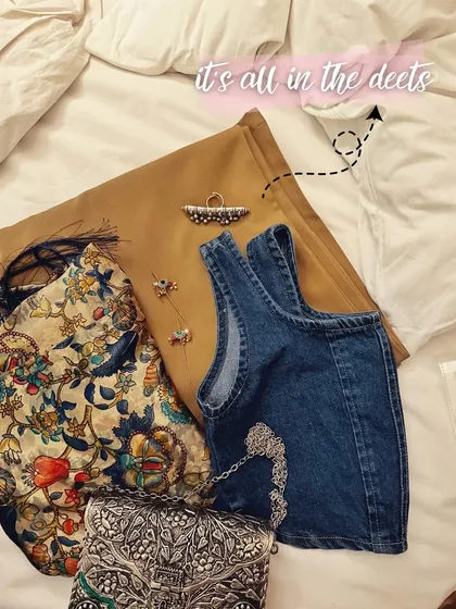 It's all in the details. A flat-lay of my Jaipur look, showing how I mixed a denim corset with a traditional printed jacket and silver accessories for a bohemian vibe.