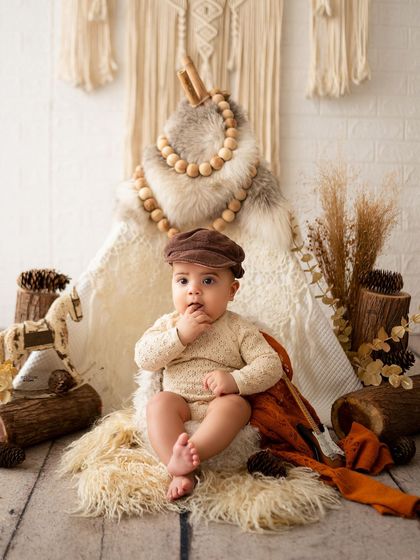 This little explorer is ready for an adventure in his newsboy cap.