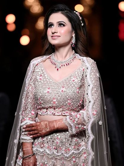 My client looking absolutely stunning for her engagement. Her intricate pink and silver lehenga is paired with smokey eyes and a soft pink lip.