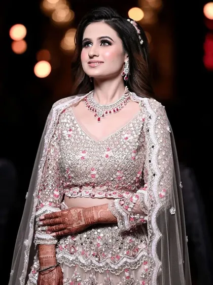 My client looking absolutely stunning for her engagement. Her intricate pink and silver lehenga is paired with smokey eyes and a soft pink lip.