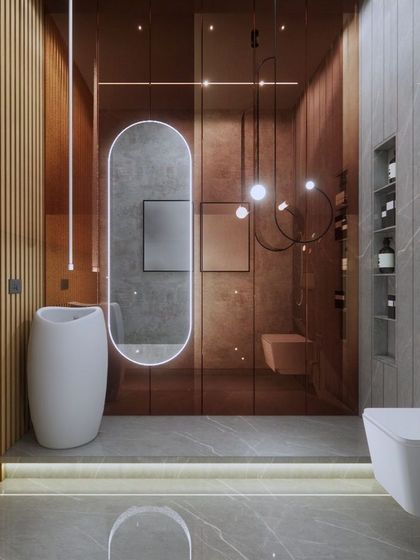 This powder room design uses a warm palette of grey, bronze, and wood. Vertical wood slats and a floating vanity create a sense of height, while pendant lights add a touch of modern elegance.