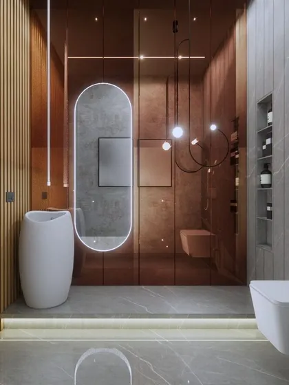 A powder room design that uses bronze-tinted glass, vertical wood paneling, and dramatic pendant lighting to create a warm, plush, and inviting space for guests.