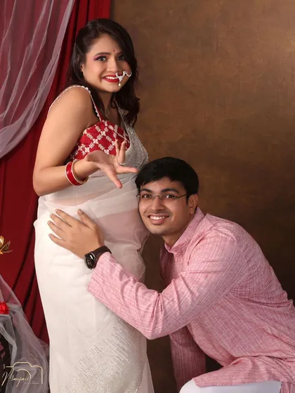 A playful and classic bump-listening pose. His happy expression is priceless.