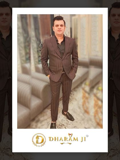 A client looking stylish in a brown pinstripe suit. A classic look that is tailored to perfection.