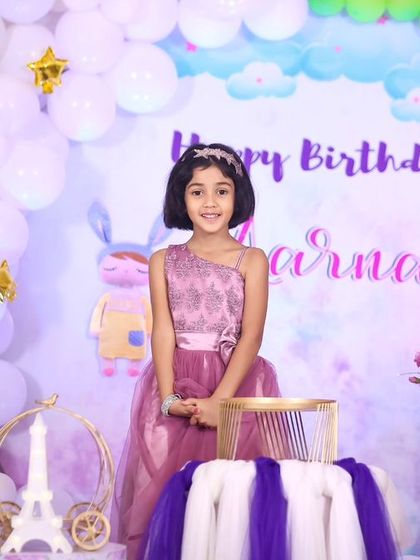 A thrilling 'Avengers' themed birthday party, with superhero cutouts, a cityscape backdrop, and dynamic balloon arrangements, ready for action.