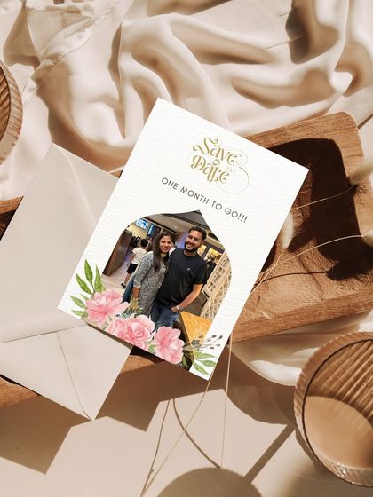 A personal touch for a Save the Date countdown. This design incorporates a photo of the couple within a floral arch, making the announcement feel intimate and special.