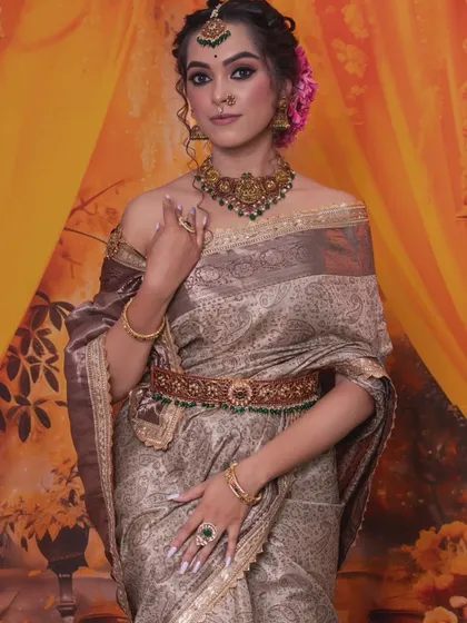 The full look, showing how the traditional jewellery adds a touch of elegance to the contemporary outfit.