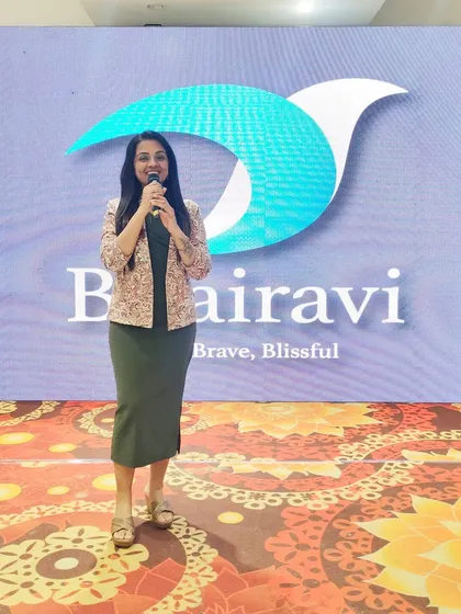 Standing proudly on stage with my logo on the LED screen behind me. This was at a spectacular 70th birthday party I planned and hosted.