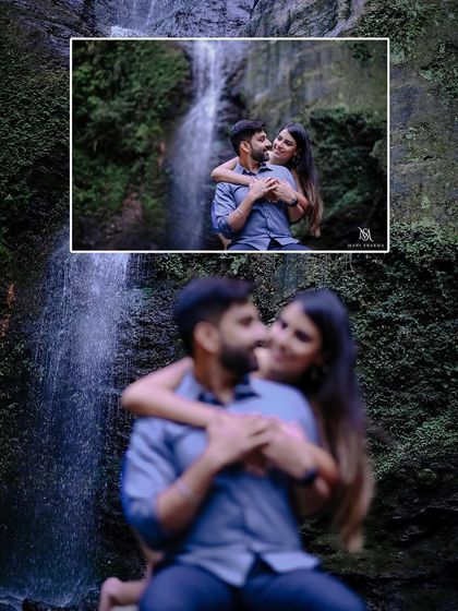 A creative shot using focus to draw attention to the couple's embrace during their waterfall pre-wedding shoot. It adds an artistic and intimate feel to the portrait.