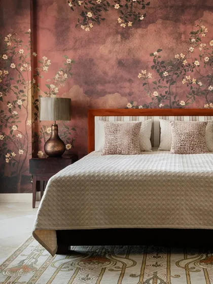 To capture the feeling of autumn, I designed this bedroom wallpaper with a moody, textured background and delicate flowering branches. The deep rust and earthy tones create a warm, cozy retreat that feels like a permanent golden hour.