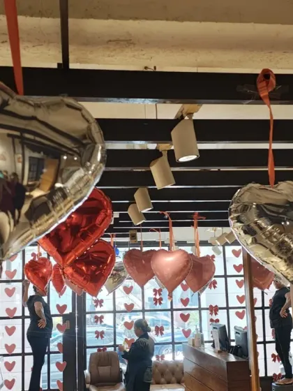 This view from an upper level shows the density of the Valentine's Day heart balloons. I arranged them at different heights to create a dynamic, floating effect that looks great from every angle.