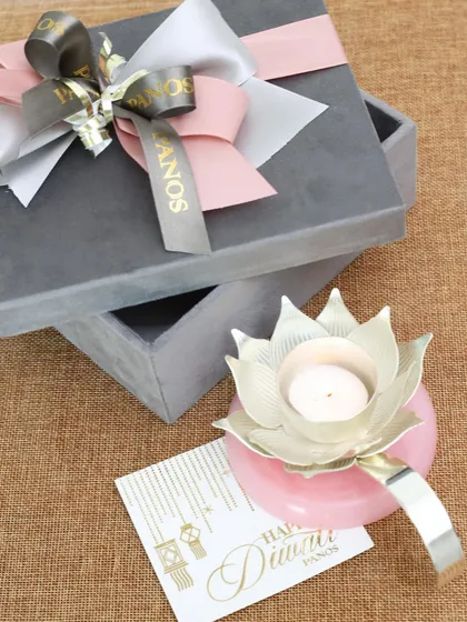 Our silver-plated lotus diya on a rose pink onyx base, presented in a luxurious velvet gift box. It’s a modern take on a traditional piece, symbolizing hope and elegance.