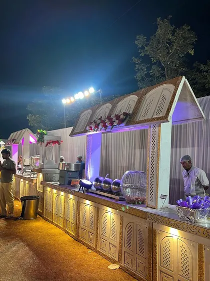 A closer look at the details of my traditional white and gold themed buffet station. Every setup includes professional chafing dishes to keep the food warm and fresh, and my uniformed staff is always on hand to ensure your guests are well taken care of.