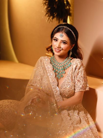 A smiling bride in a beautiful sequined lehenga. This is a perfect look for a Sangeet or engagement.