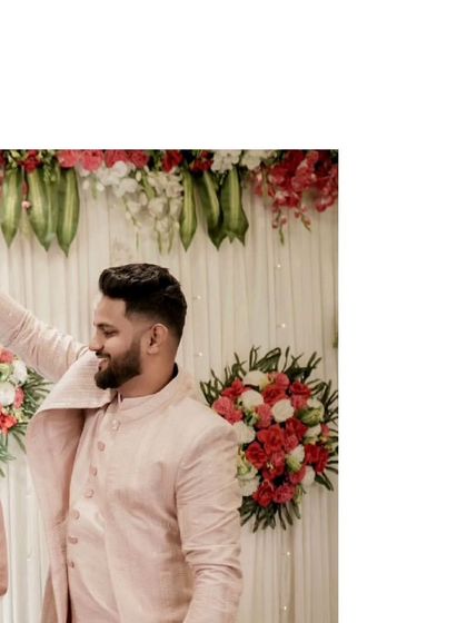 This is a great example of modern coordination. He is wearing a simple yet elegant pink Indo-Western kurta, which perfectly matches her beautiful ruffle gown.