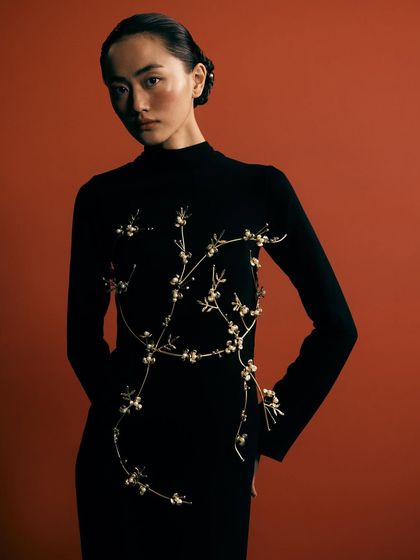 A full view of the stunning floral body piece. This is a statement piece, and the styling was designed to present it as wearable art.