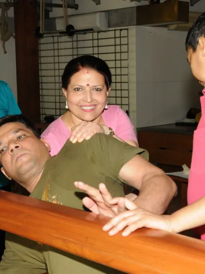 Every pose tells a story of care and dedication. Here, I am providing a hands on adjustment to a student using a prop, reflecting the personalized support we offer to help each individual heal and grow.