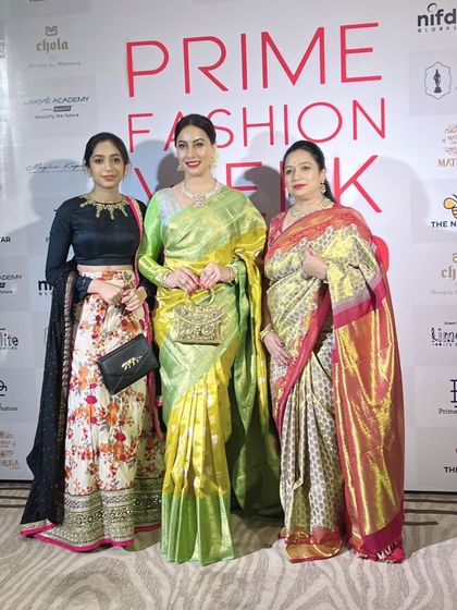I am pictured here with our showstopper, Dr. Shruthi Chethan, and my daughter Rachana at Prime Fashion Week. Together, we represent the heart and soul of Mathura Creations.