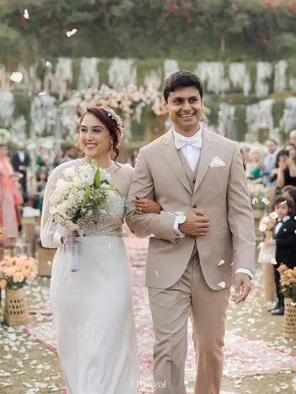 The recessional walk, filled with smiles and a shower of petals. This is the picture of pure, unadulterated happiness, and I aim to capture that energy in a way that feels vibrant and alive.