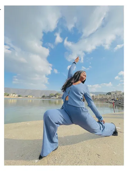 Finding a moment for a reverse warrior pose by the serene lake in Pushkar, Rajasthan. Yoga can be practiced anywhere, connecting you to the energy of your surroundings.