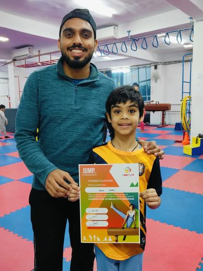 This young boy is happy to show off his "JUMP" program certificate.
