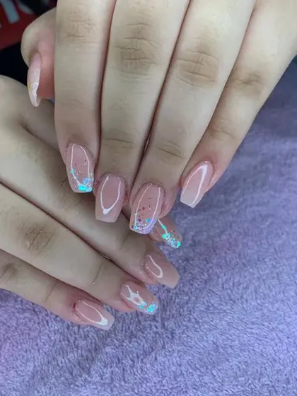 A subtle and pretty design with a sheer nude base and small, encapsulated iridescent flakes.