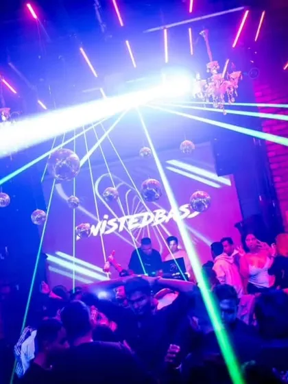 My 'TwistedBass' logo on the screen at Roxy, with lasers cutting through the smoke. The visual production is a huge part of my show.
