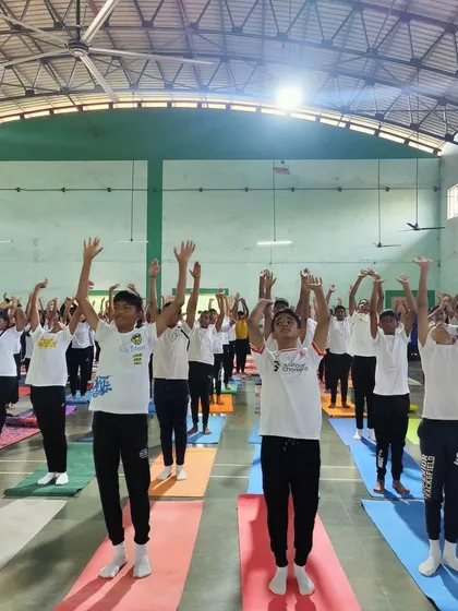 A moment of collective stretching and reaching upwards during our Yoga Day celebrations in Goa. It symbolizes the aspiration for higher consciousness that Yoga fosters.