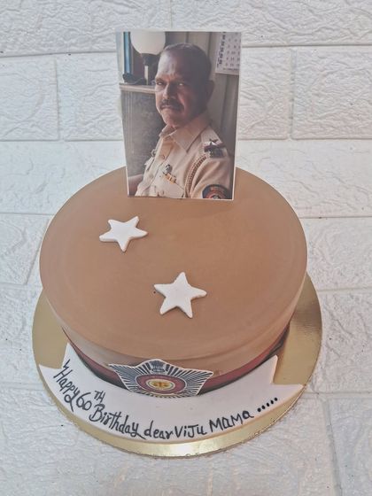 A tribute to a police officer's 60th birthday and retirement. This cake is designed to look like a police uniform, with a photo topper to make it extra personal and honorable.