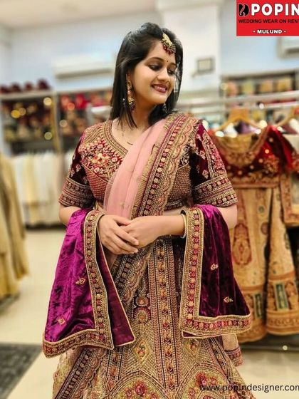 A closer look at the rich maroon velvet and exquisite gold embroidery of this royal bridal lehenga. The craftsmanship is designed to make you feel graceful and breathtaking.