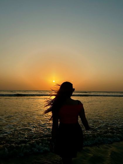 A silhouette shot against a beautiful sunset in Goa. This artistic photo is all about capturing the mood and the moment.