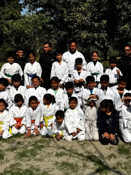 A group photo of our young karatekas after an outdoor training session. The bonds they form are as important as the skills they learn.
