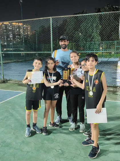 Another shot of our U-12 mixed team with their runner-up trophy. Competing in mixed-gender teams helps build versatile skills and sportsmanship.