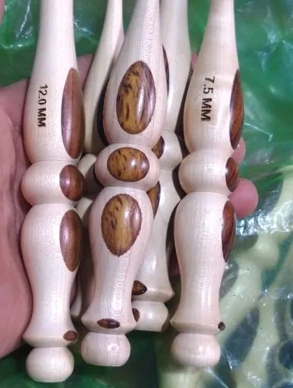 A close up of my light-wood hooks with a distinctive grain pattern. The size, like the 7.5 MM and 12.0 MM shown here, is clearly marked for your convenience.