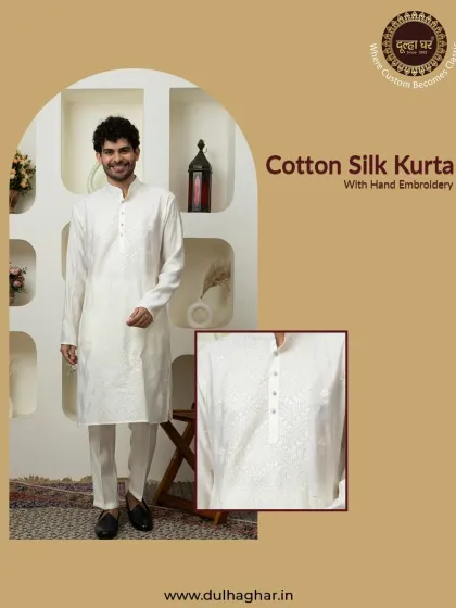Classic charm meets modern elegance. A white cotton silk kurta with exquisite hand embroidery, a perfect choice for any festive occasion.