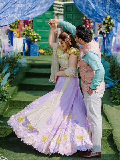 A candid moment of the couple dancing. The makeup is designed to look fresh and beautiful even in bright daylight, and it's completely sweat-proof.