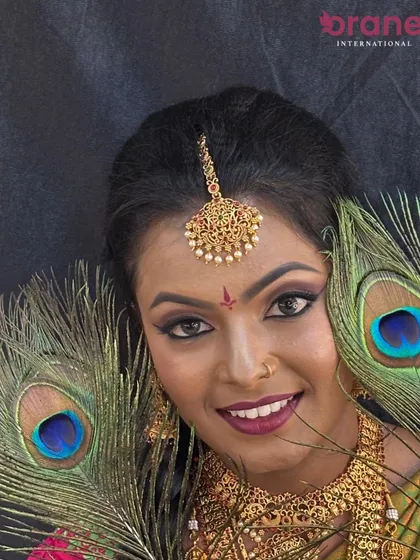 A smiling portrait that captures the joy and confidence of a bride on her special day.