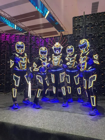 A backstage look at our crew in our futuristic robotic armor. Every suit is designed by us with intricate LED patterns that are programmed to sync perfectly with the music and choreography.