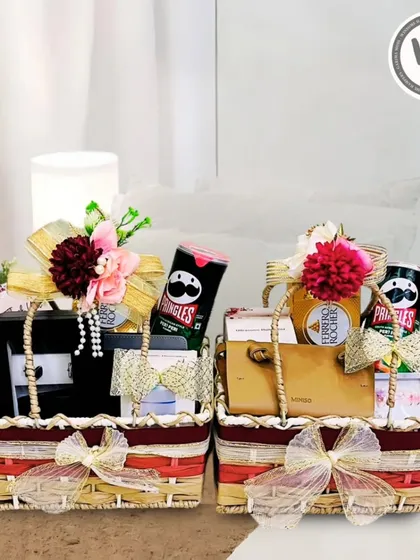 A heartfelt gesture for the bride and groom. These matching hampers are curated with a mix of personal items and treats, wrapped in sophistication to celebrate their union.