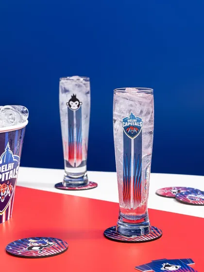 A high-energy, graphic shot for the Bira 91 and Delhi Capitals IPL collaboration. I used the team's bold red and blue colors as the background to create a powerful, sporty visual for their branded merchandise.