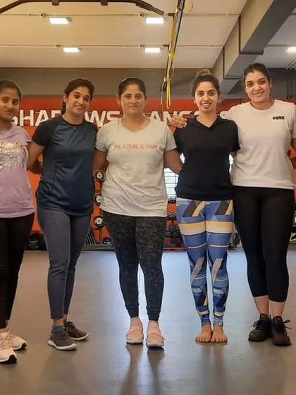 A group of strong, capable women from our group strength and cardio classes. They prove every day that women are incredibly powerful.