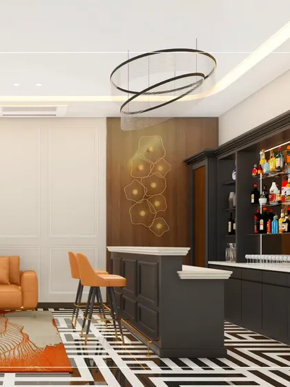 We design spaces for every part of your life, including this sophisticated home bar and lounge area. The custom dark wood cabinetry, striking geometric floor tiles, and modern sculptural lighting come together to create an elegant setting for entertaining guests or enjoying a quiet evening.