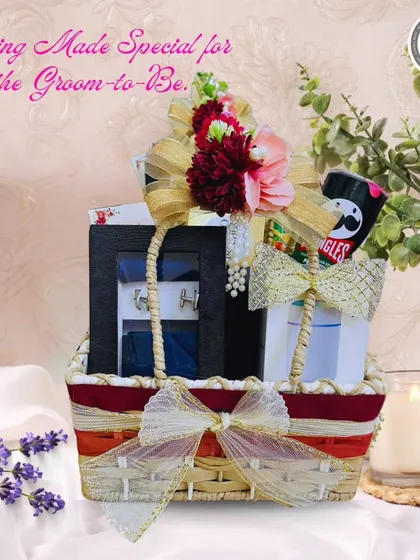A special hamper curated for the groom-to-be. This basket combines his favorite snacks with elegant accessories like cufflinks, making it a thoughtful and personalized pre-wedding gift.