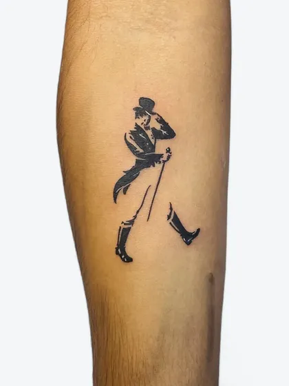 A fun and iconic tattoo of the Johnnie Walker "Striding Man" logo. We can recreate logos and pop culture icons with precision.